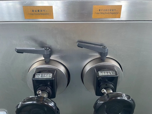 Automatic plastic tube filling and sealing machine