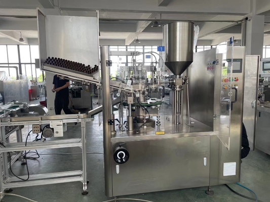Automatic plastic tube filling and sealing machine